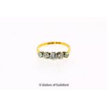 Five stone diamond ring, graduated old cut diamonds claw set in white metal on a yellow metal shank,