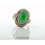 *Jade and coral ring, oval jade stone mounted in white metal tested as silver, hinged opening with a