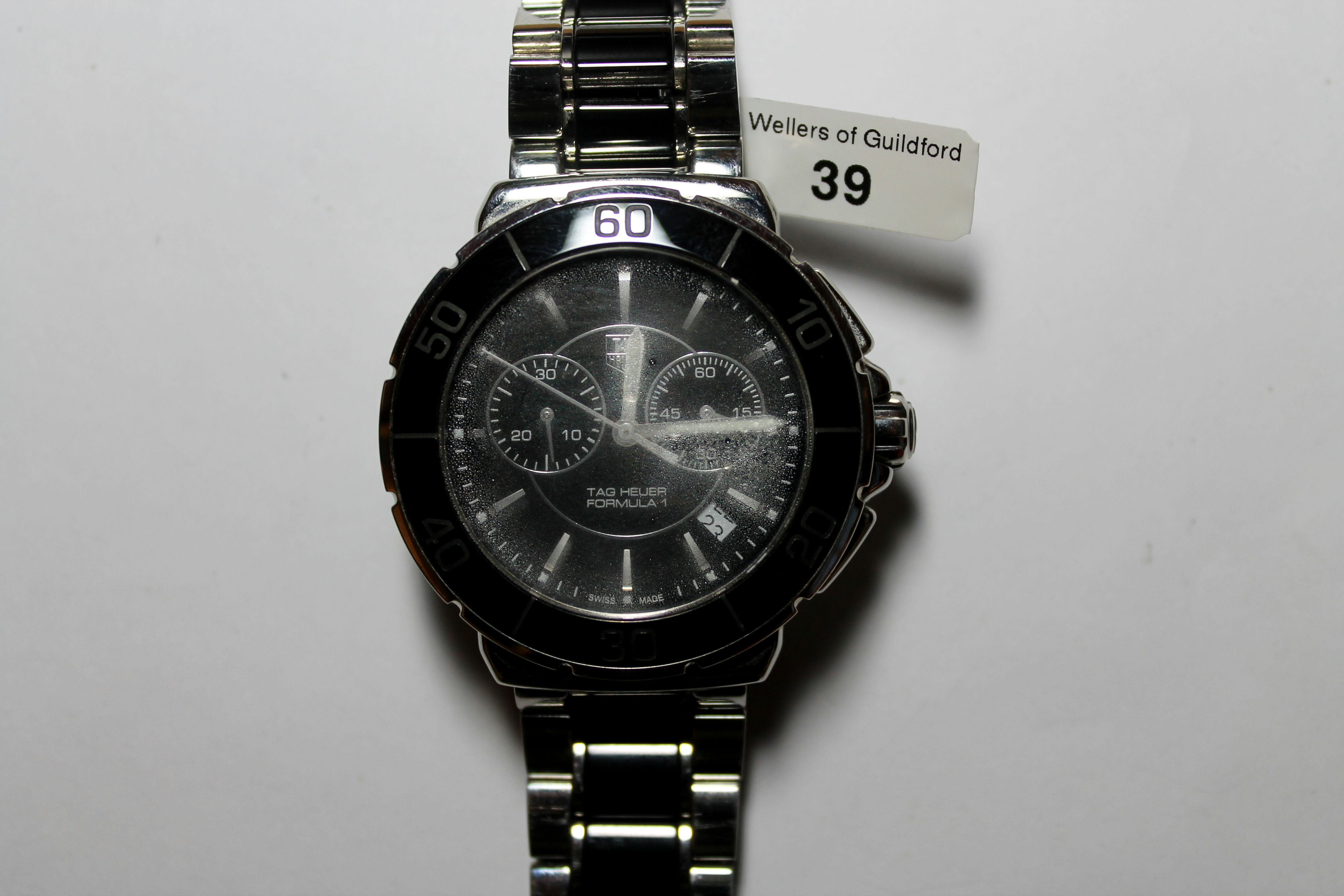 *Tag Heuer Formula 1 wristwatch, stainless steel and black ceramic, with baton hour markers, date