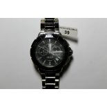 *Tag Heuer Formula 1 wristwatch, stainless steel and black ceramic, with baton hour markers, date