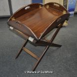 A reproduction butler's tray on stand.