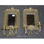 A pair of Victorian three girandole mirrors, vase and leafscroll top, pierced frame over mask