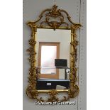 A rectangular giltwood mirror with scrolling acanthus mount, 92 x 54cm