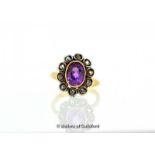 Amethyst and diamond cluster ring, oval cut amethyst rubover set, with a surround of rose cut