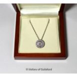 *Diamond cluster pendant, central rubover set round brilliant cut diamond weighing an estimated 0.