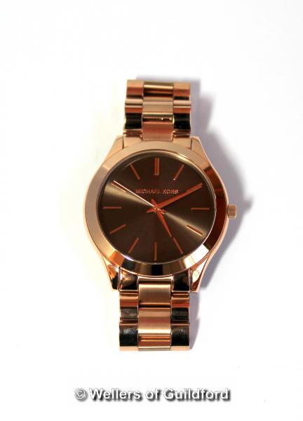 *Michael Kors wristwatch, circular grey dial with baton hour markers, in rose coloured stainless