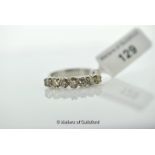 Seven stone diamond ring, round brilliant cut diamond claw set in white metal tested as 9ct,