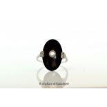 Onyx and diamond ring, oval onyx with a round brilliant cut diamond millegrain set to the centre,