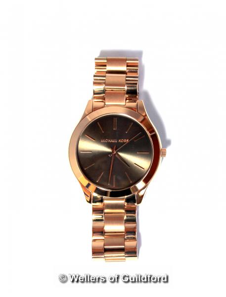 *Michael Kors wristwatch, circular grey dial with baton hour markers, in rose coloured stainless