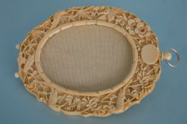 A good quality well carved ivory picture frame dec