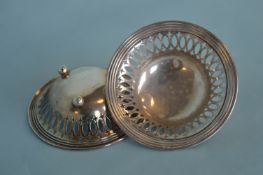 A pair of small Sterling bonbon dishes on ball fee