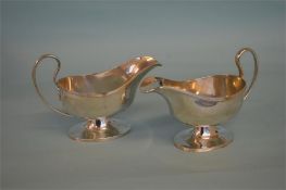 A pair of good pedestal sauce boats with reeded ri