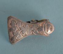 An attractive napkin clip engraved with flowers an