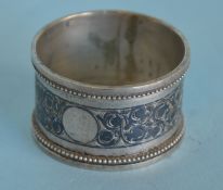 A Russian niello napkin ring with ball decoration.