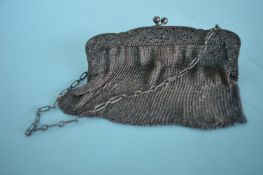 A heavy Continental mesh purse with pierced handle