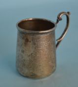 A small tapered christening cup with scroll handle