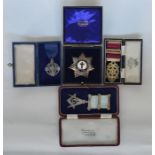 Four silver hallmarked Masonic medals and badges.