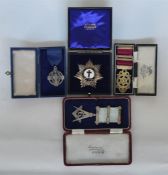 Four silver hallmarked Masonic medals and badges.