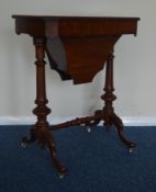 A Victorian mahogany sewing table on stretcher bas