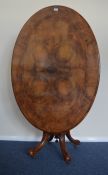 An attractive walnut loo table on turned and carve