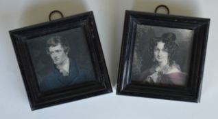 A pair of square engravings in ebony frames. Appro