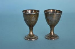 A pair of Georgian Irish egg cups with reeded base