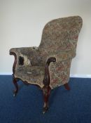 A good large mahogany armchair on scroll supports.