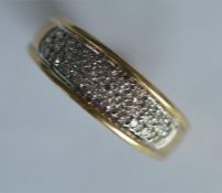 A small diamond two colour gold ring. Approx. 3.5