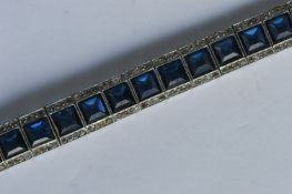 A French paste bracelet mounted in silver with con
