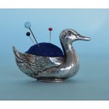 A small unusual pin cushion in the form of a duck.