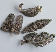 A selection of silver mounted double clip and othe