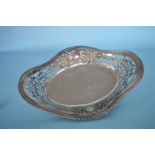 A large oval boat shaped bread dish with embossed
