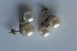 An attractive pair of cultured pearl and diamond f