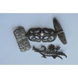 Four silver and marcasite brooches. Est. £20 - £30