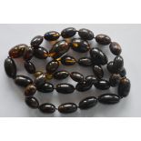 A long graduated string of amber beads. Approx. 48