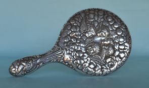 A silver cherub decorated hand mirror. Chester by