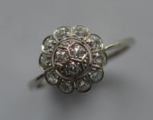 An attractive circular diamond cluster ring in pla