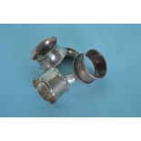 Four heavy napkin rings with pierced decoration. A