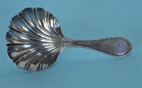 An attractive scroll decorated caddy spoon with be