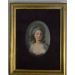 An attractive painted oval portrait of a lady in v