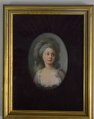 An attractive painted oval portrait of a lady in v