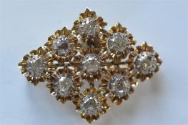 An Antique rose diamond 9 stone brooch in gold and