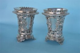 A good pair of Continental bottle vases pierced wi