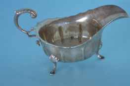 A small silver sauce boat with card cut rim. Birmi