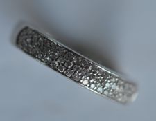 An attractive white gold half eternity ring set wi