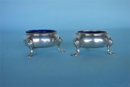 A pair of circular Georgian salts with beaded rim.