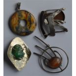 A group of four modernistic silver brooches. Est.