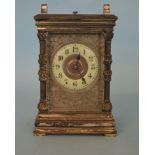 A large plated carriage clock with engraved dial a