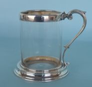 A Victorian silver mounted glass pint mug on taper