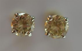 A pair of diamond single stone brilliant cut ear s